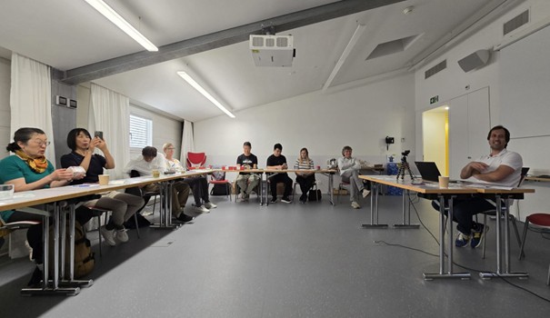 Participants engage in active discussion during the seminar session at EOC Locarno.